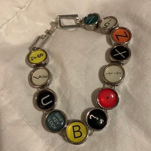 Typewriter Keys Bracelet approximately 7” fastened.